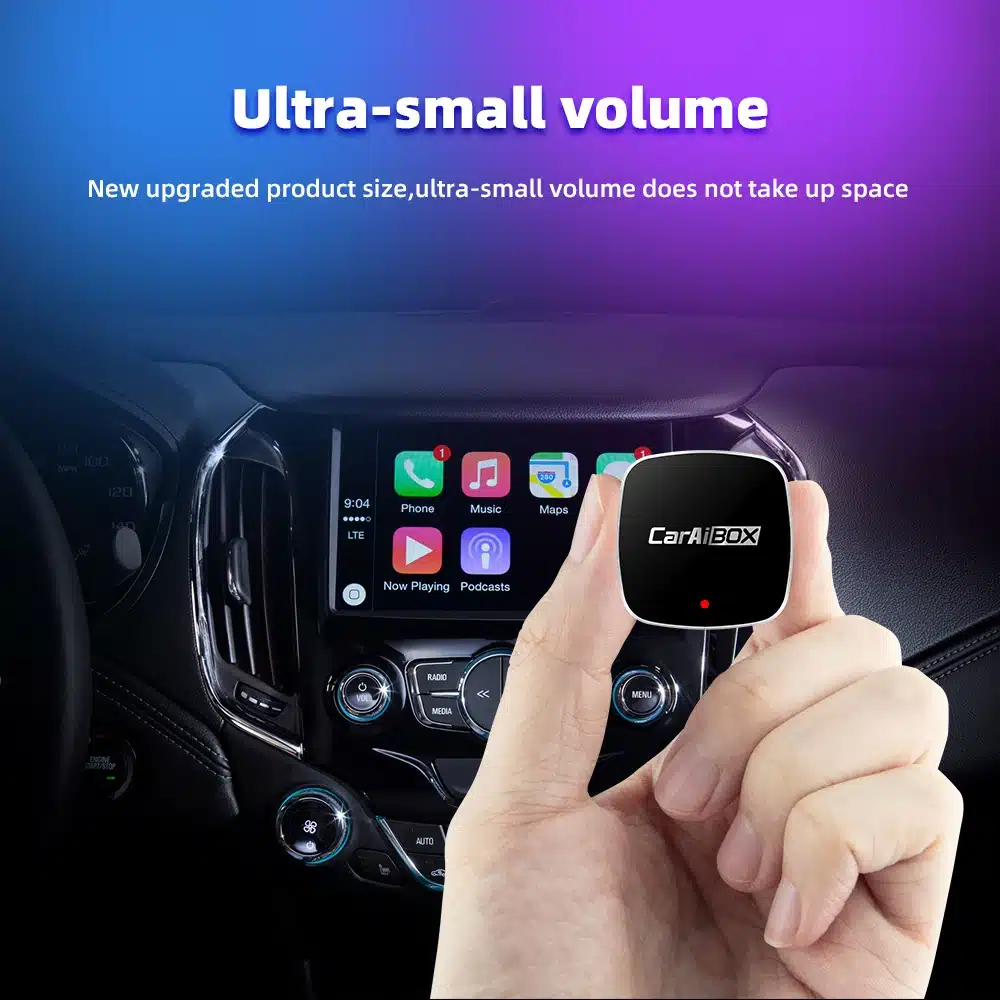 a hand holding a device in a car